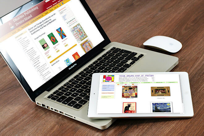 Photo of a laptop monitor showing Magento eCommerce of Dharmapublishing Deutschland Shop